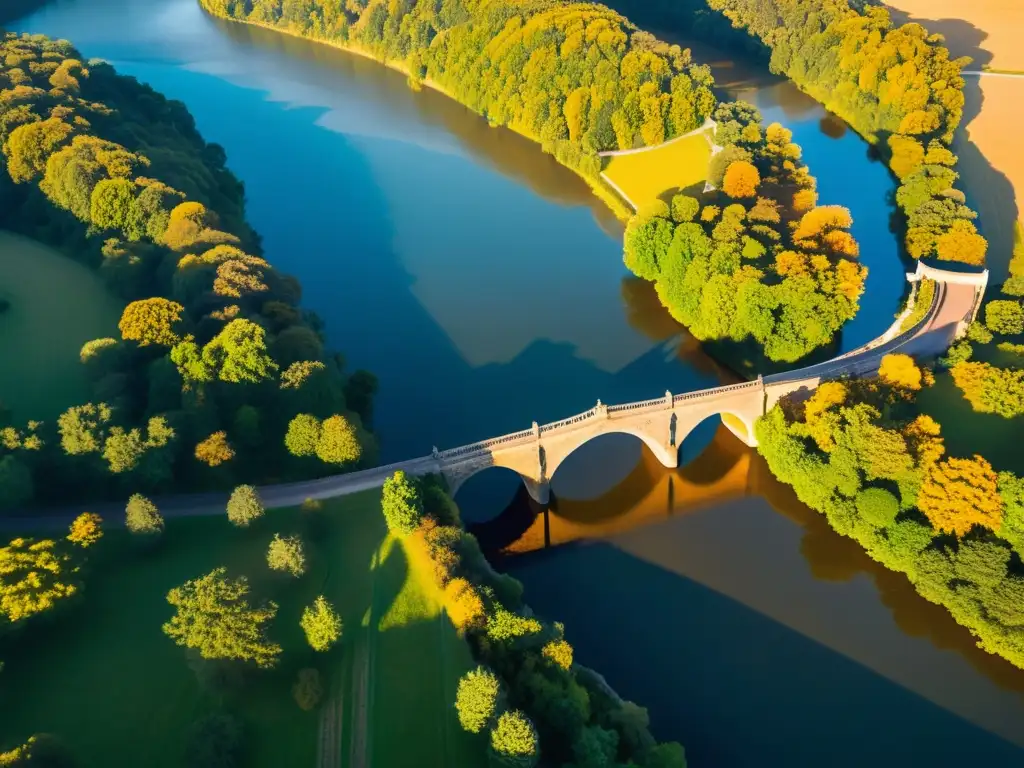 Puente antiguo capturado con drones, bañado por la luz dorada del atardecer sobre un río tranquilo y paisaje verde